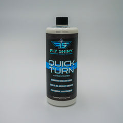 Fly Shiny Quick Turn 32 oz Concentrated Aircraft Dry Wash bottle on a gray background, professional aviation-grade waterless cleaner that dilutes to 80 gallons.