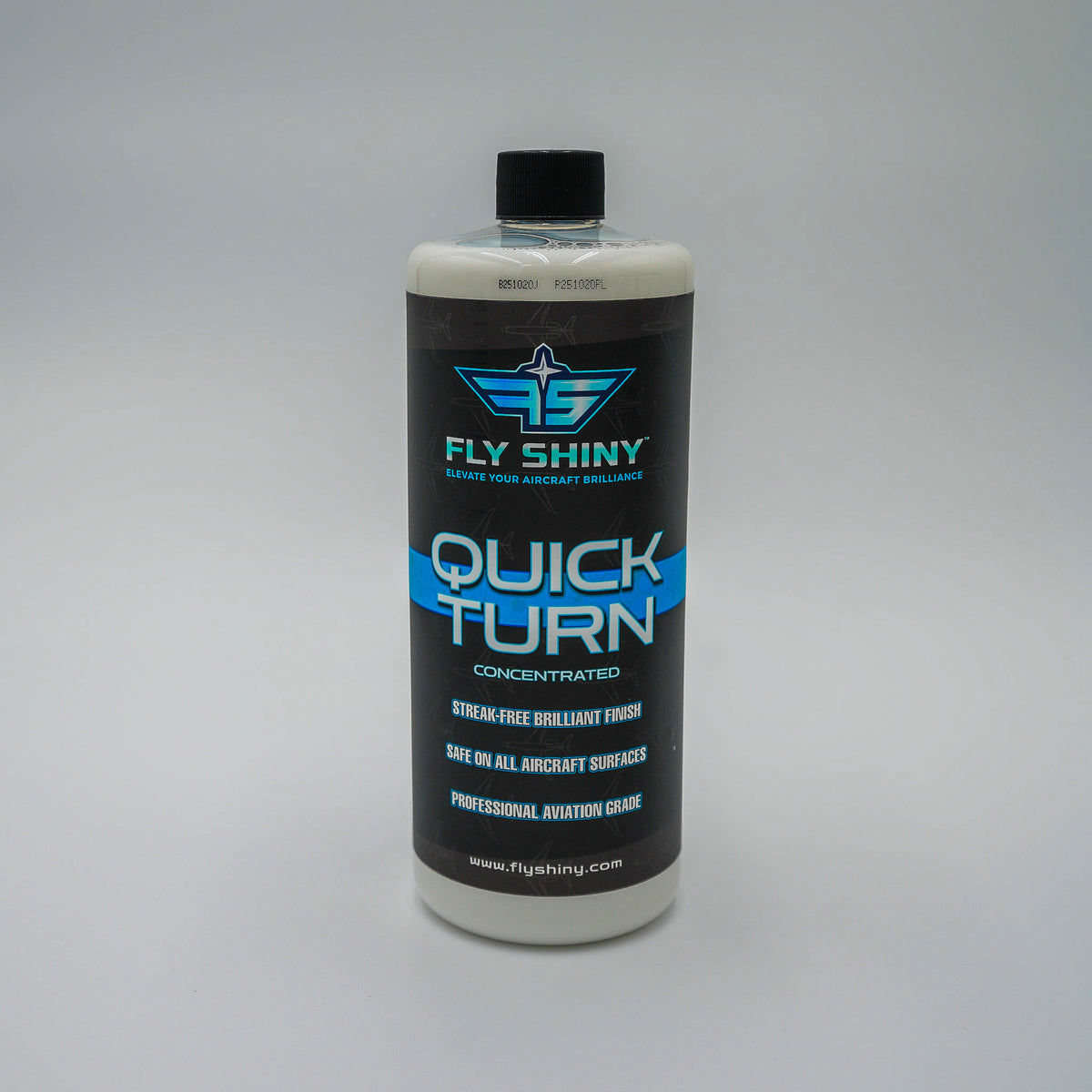 Fly Shiny Quick Turn 32 oz Concentrated Aircraft Dry Wash bottle on a gray background, professional aviation-grade waterless cleaner that dilutes to 80 gallons.